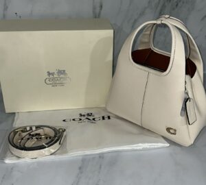 cartera coach premium