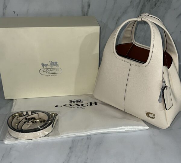 cartera coach premium