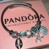 PULSERA PANDORA CON CHARMS